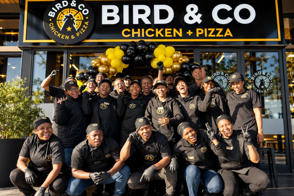 The Bird & Co flock celebrating outside their restaurant